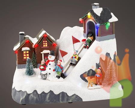 VILLAGGIO DI NATALE CON PISTA ANIMATA 13X21,5X17CM